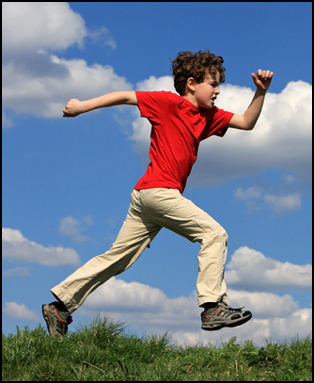 Picture of a little boy running.